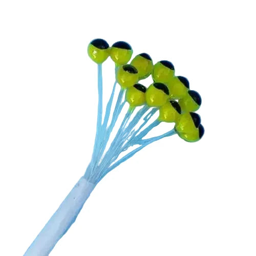 Neon yellow-green glossy fly eyes with black pupils bound by white thread