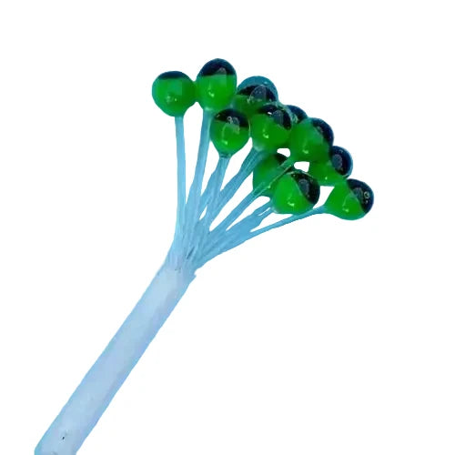 Green plastic fly eyes with black pupils bundled on light blue stems