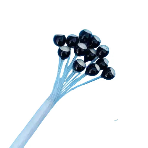 Faceted black weights with silver metallic faces on blue fly tying stems