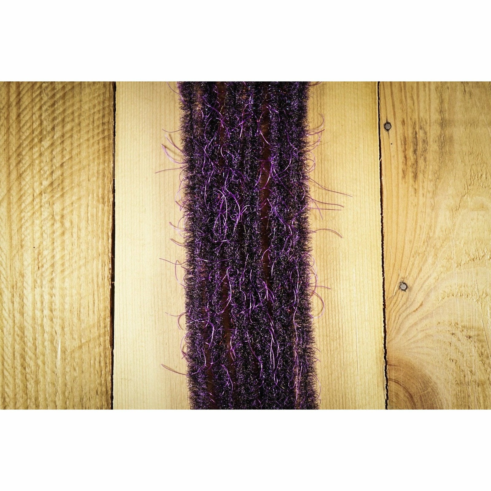 EP Wooly Critter Brush .5" Black & Purple fly tying material strip on wood
