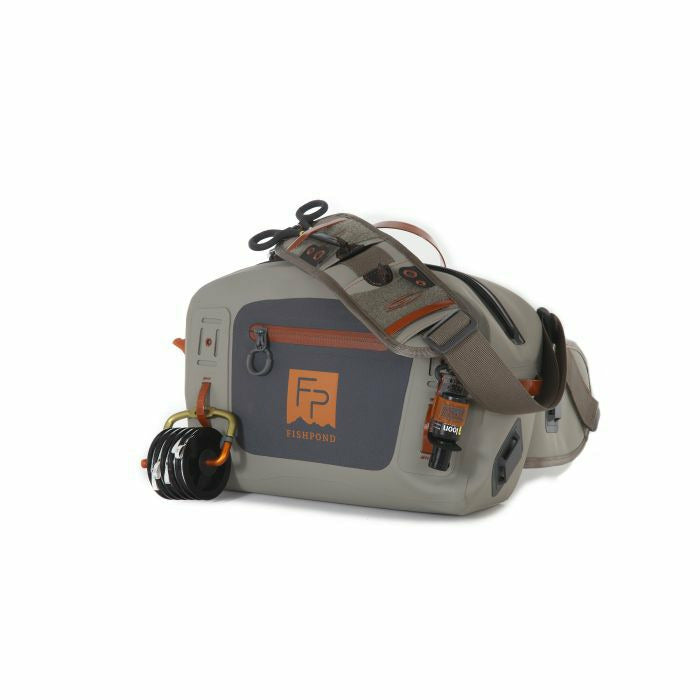 Light grey Fishpond Thunderhead lumbar pack with side D-ring for fishing line