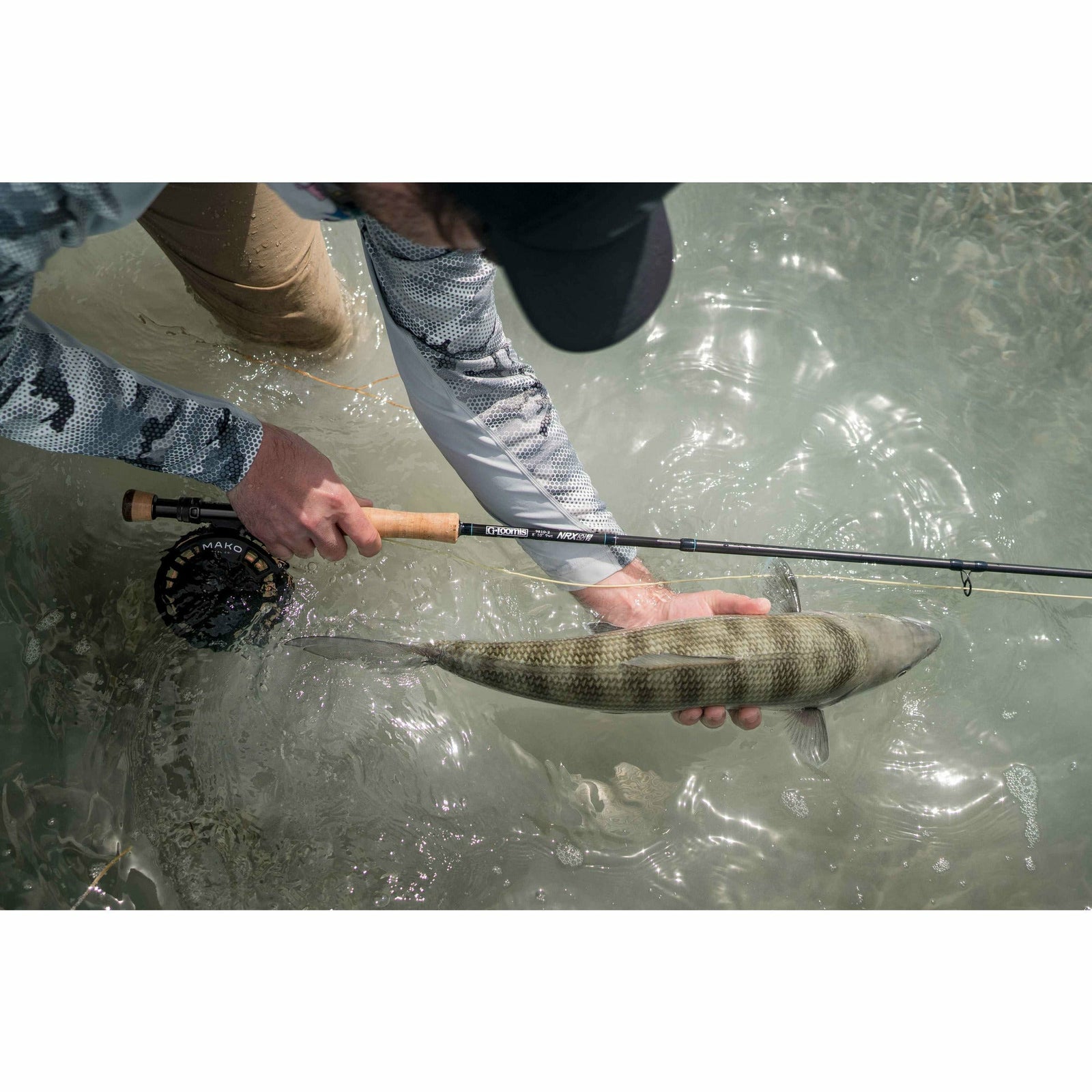 Angler using G Loomis NRX+ T2S fly rod for saltwater fishing