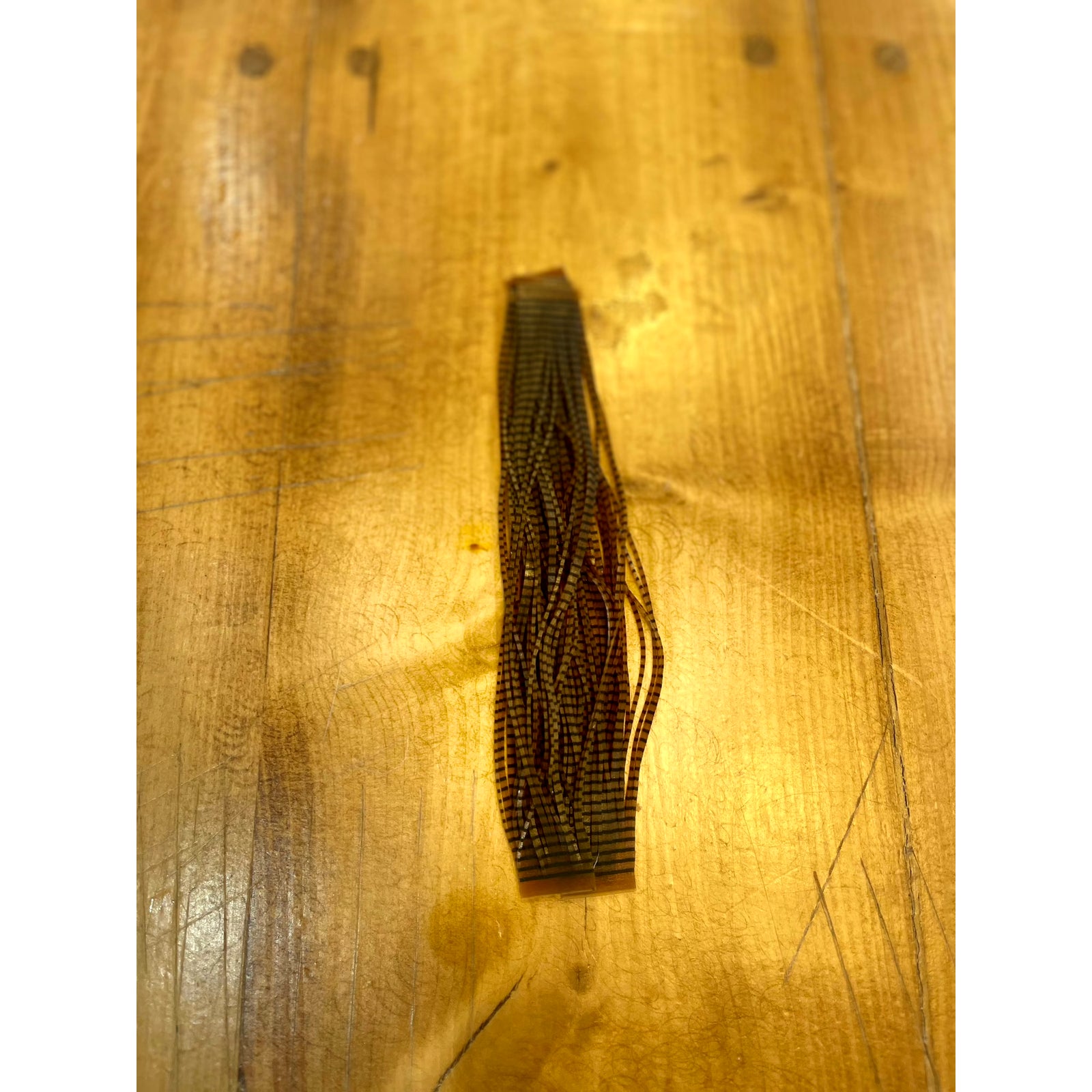 Black barred rootbeer Grizzly Flutter Legs fly tying material