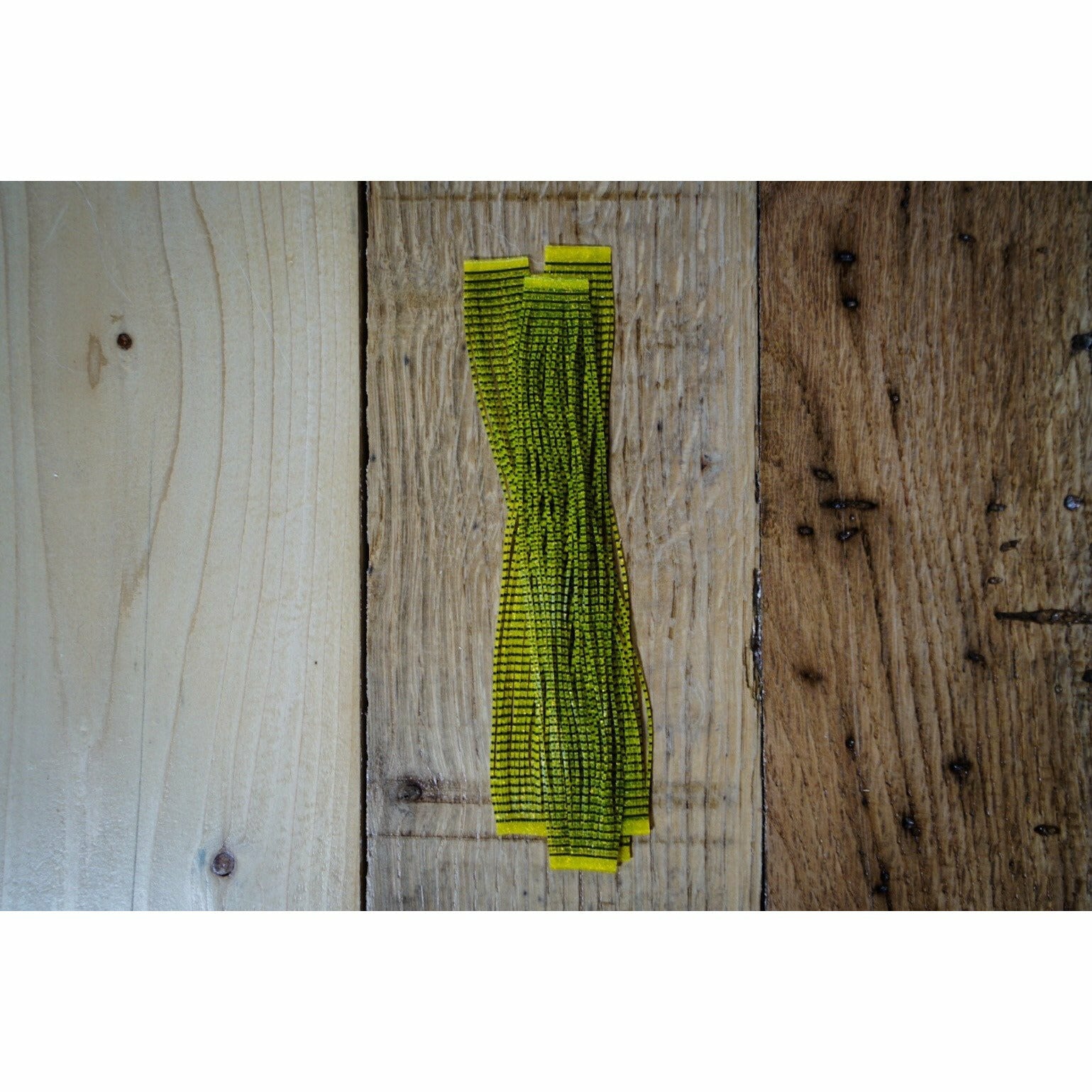 Hot Yellow Bared Grizzly Flutter Legs fly tying material with black striations