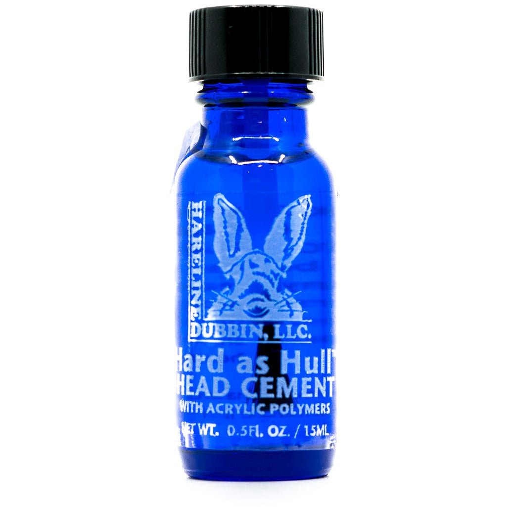 Hareline Dubbing Hard As Hull Head Cement in translucent cobalt blue glass bottle with black cap
