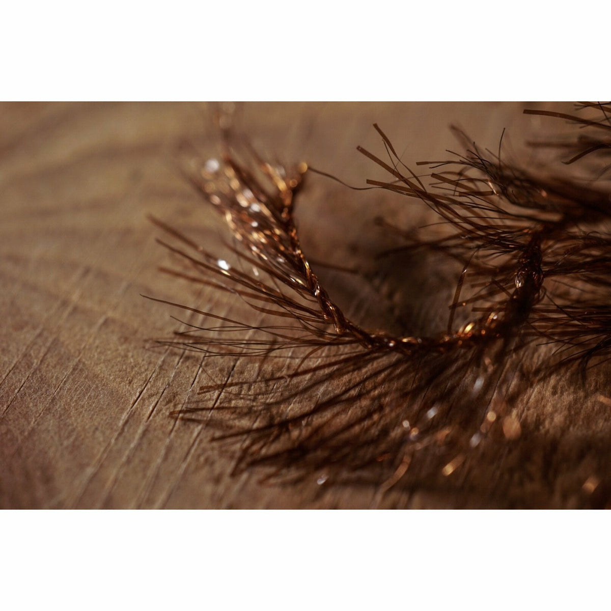 Close-up of brown synthetic Krystal Hackle fibers and reflective flash