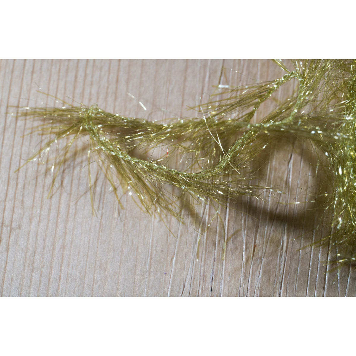 Olive Krystal Hackle fly tying material with reflective flash and twisted stem