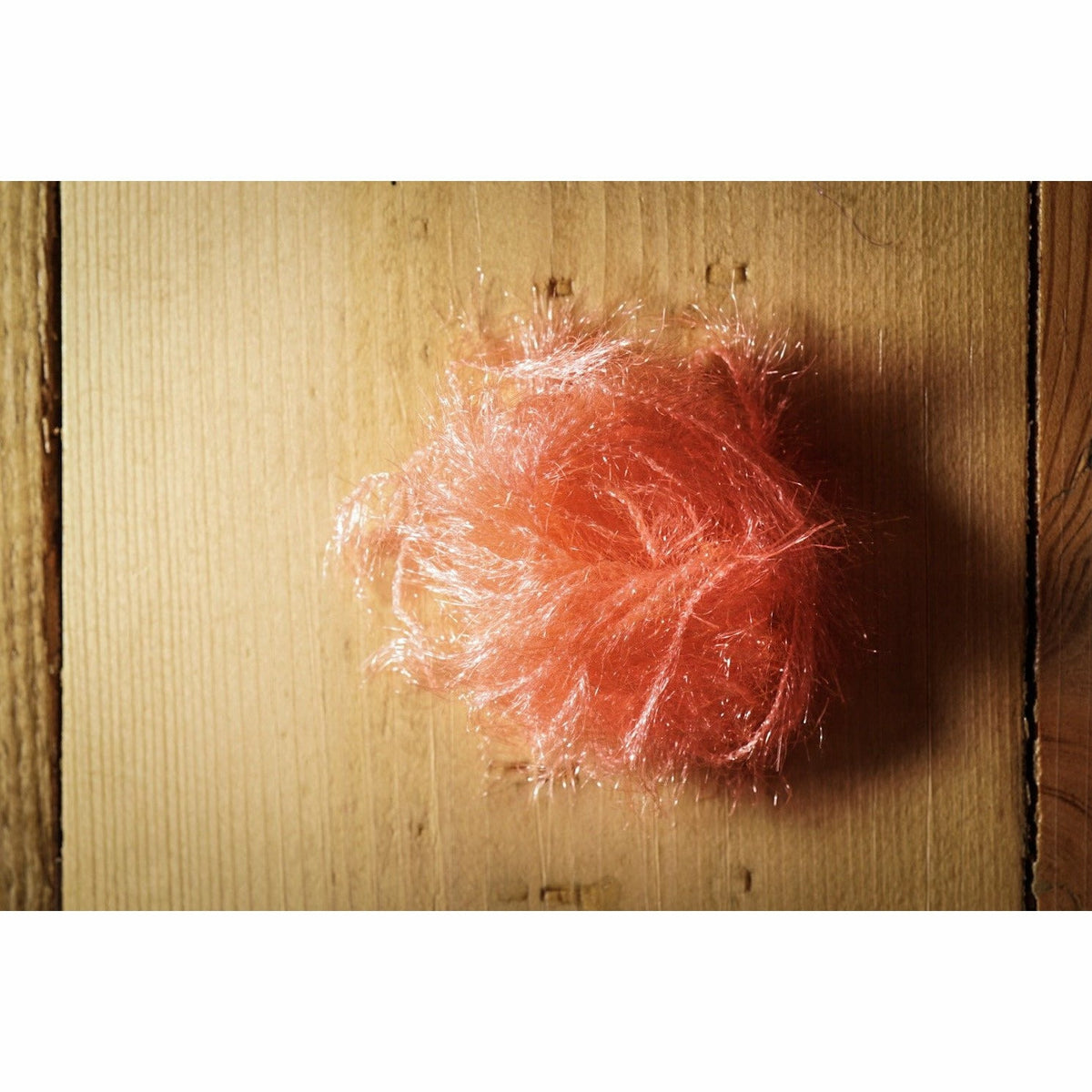 Bundle of Hareline Dubbing Krystal Hackle in vibrant shrimp pink for fly tying