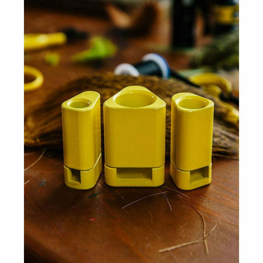 Yellow Loon hair stackers on wooden workbench with fly tying materials