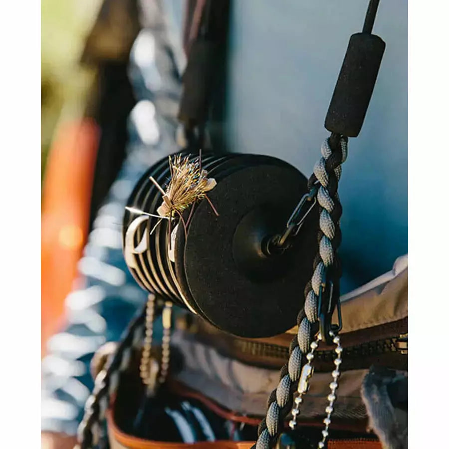 Loon Rigging Foams with dry fly pinned to black disc on paracord lanyard