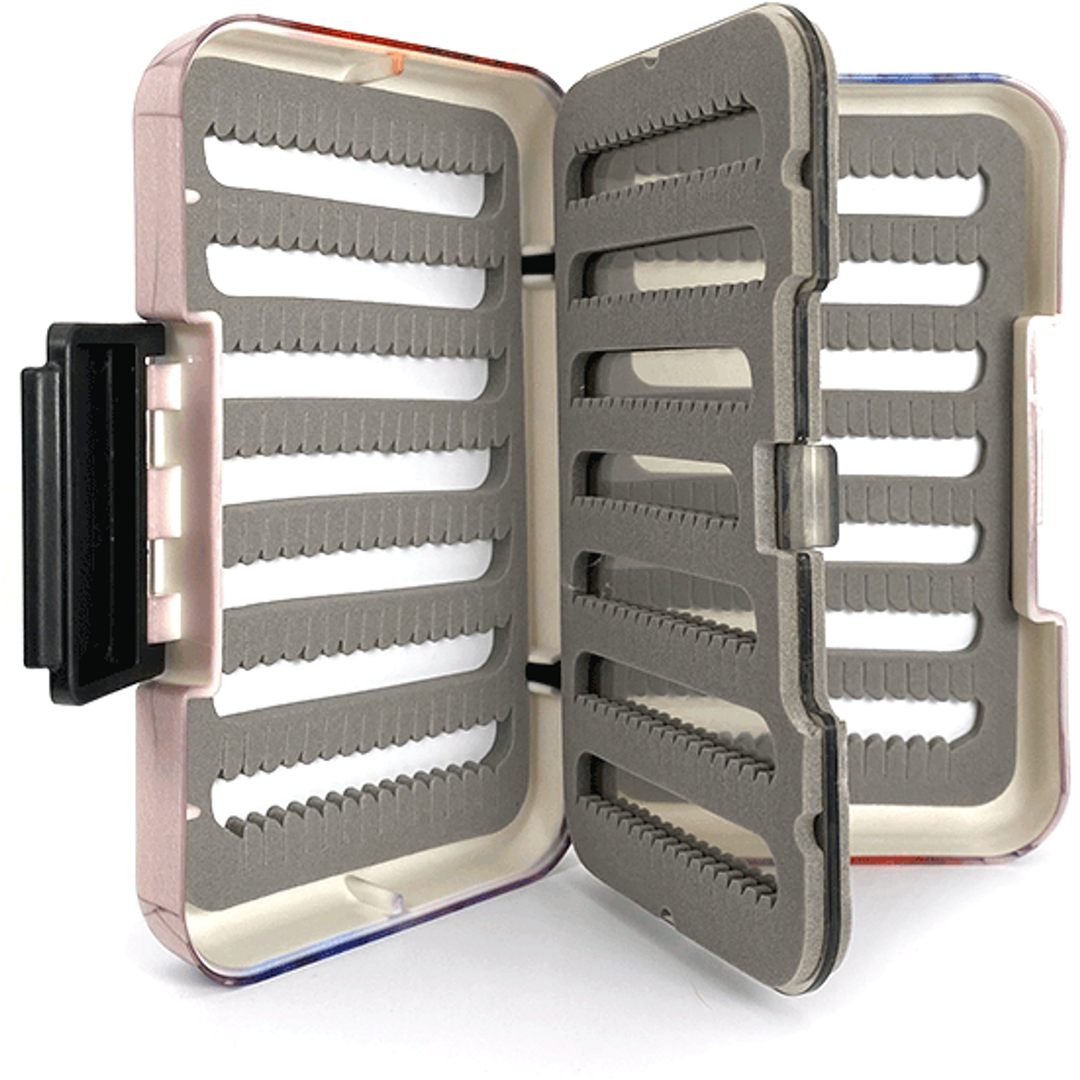 Open translucent pink MFC poly fly box with grey foam slots for flies