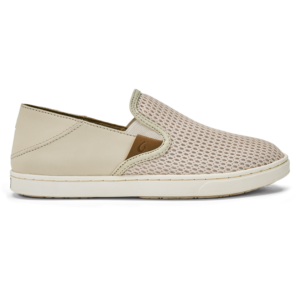 Olukai Pehuea beige slip-on sneaker with tan leather tab and removable insole