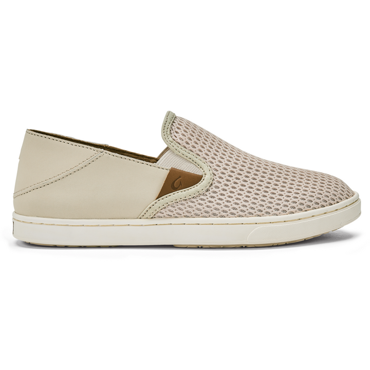 Olukai Pehuea beige slip-on sneaker with tan leather tab and removable insole