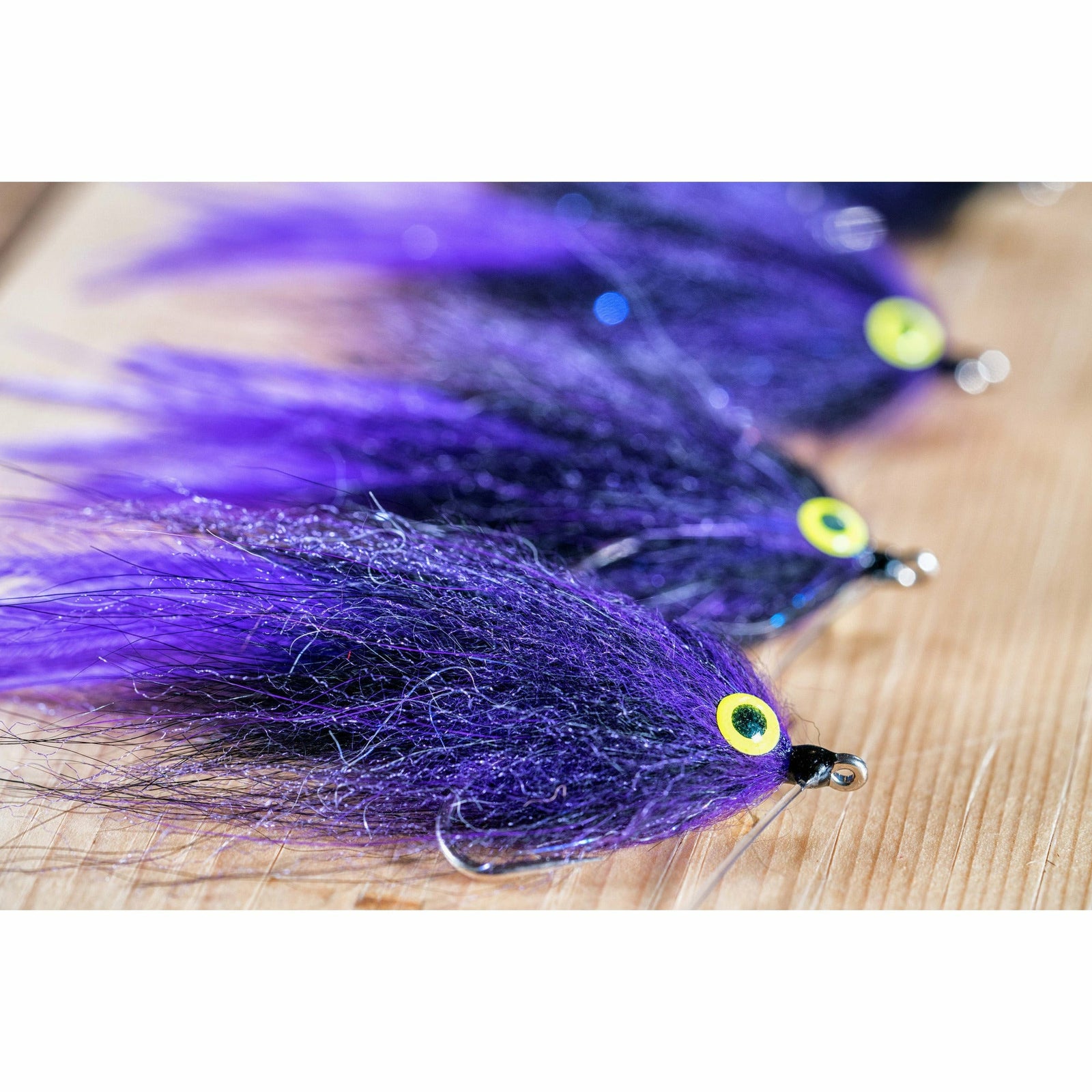Midnight Rider fly tying kit finished flies with purple black Arctic Fox hair and yellow eyes