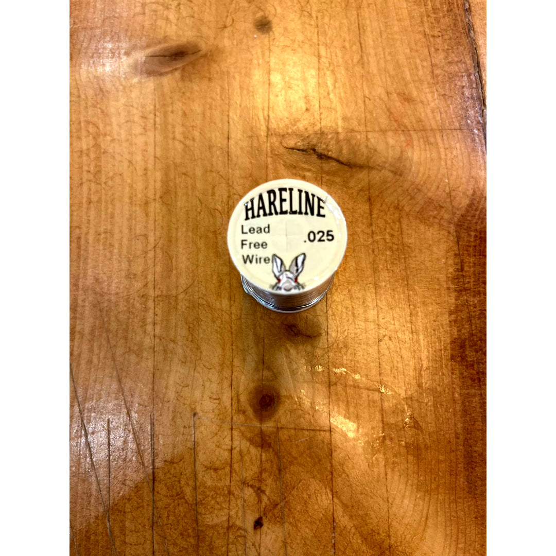 Close-up of Hareline Lead Free Wire .025 silver spool label