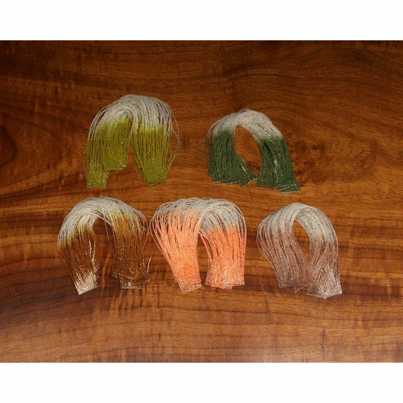 Assorted color gradient Shrimpy Crabby Legs fly tying materials on dark wood surface
