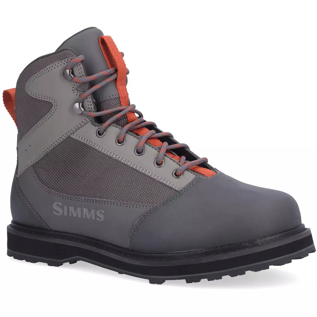 Simms Tributary grey rubber wading boots with orange accents and synthetic leather upper