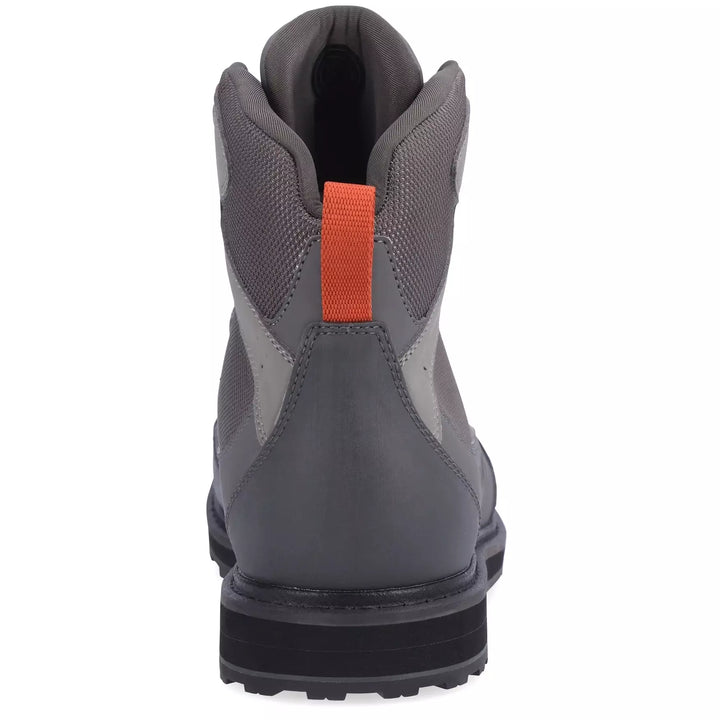 Rear view of Simms Tributary wading boot featuring orange heel pull tab and neoprene lining
