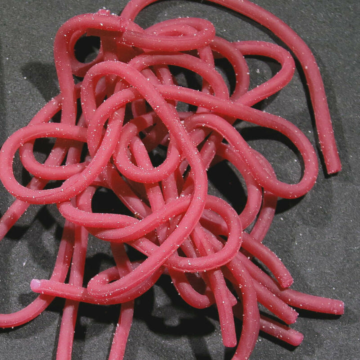 Bright pink Squirmy Wormies synthetic fly tying material with sparkle