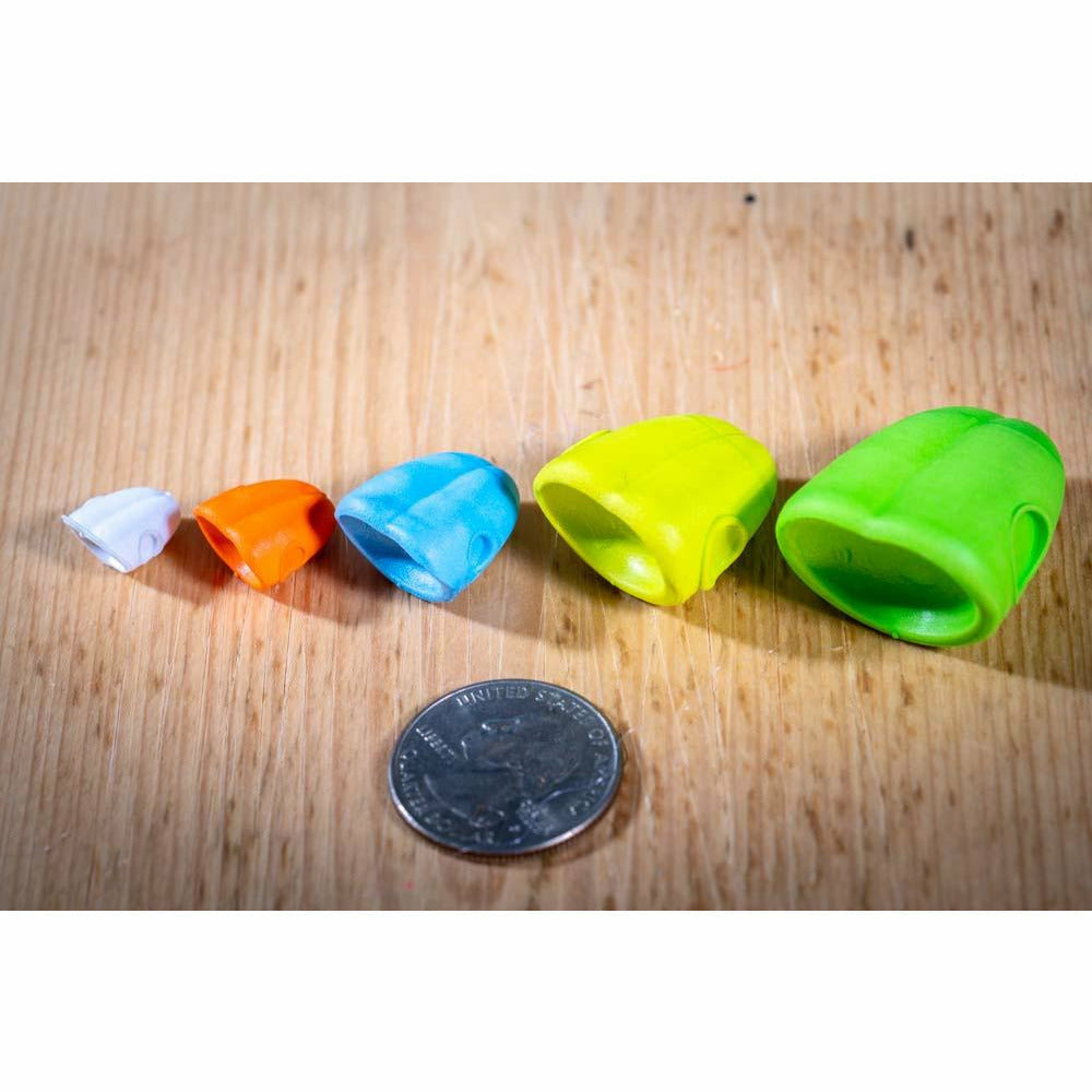 White, orange, blue, neon yellow, and lime green double barrel popper slider bodies with hollow interiors for fly tying