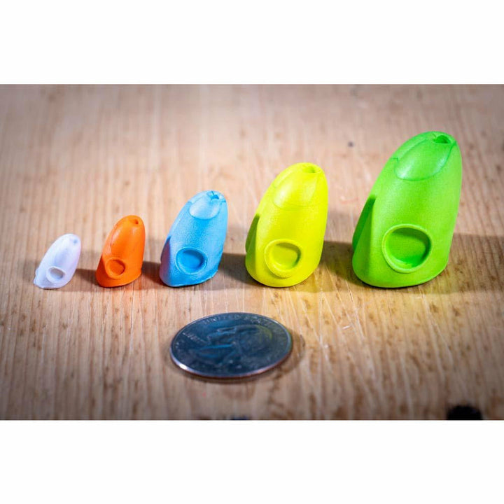 Side view of five colored double barrel popper slider bodies showing circular eye holes and size profile