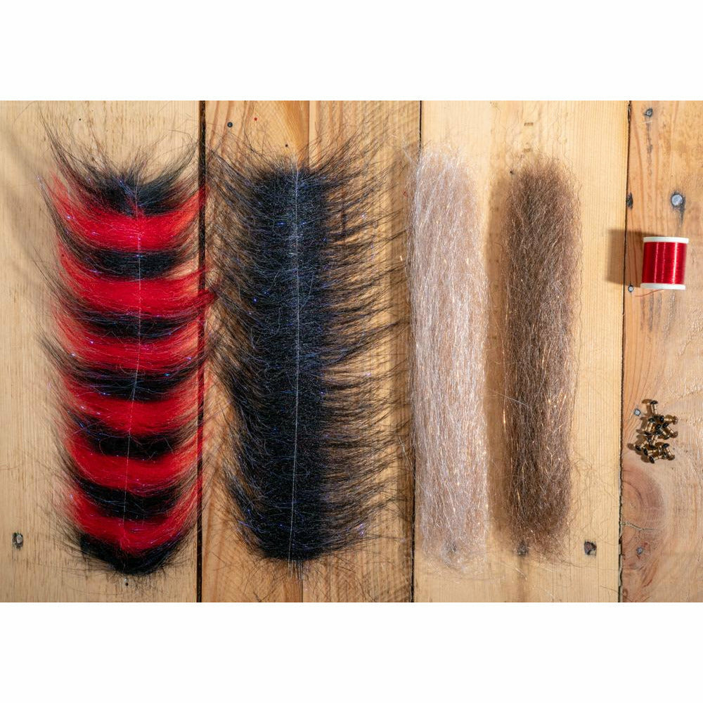 DLP Minnow DIY Kit fly tying materials including red black striped fibers, hooks, and thread for making large saltwater flies
