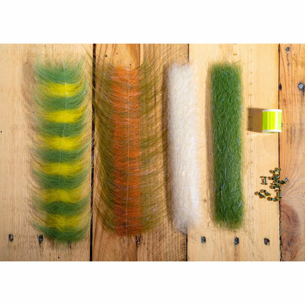 DLP Minnow DIY Kit materials: yellow green striped fiber, orange brown brush, olive gold bead eyes, and neon thread for tying big game flies