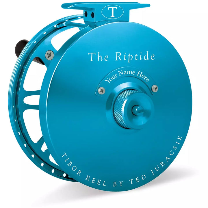 Teal blue Tibor Riptide fly reel showing textured drag knob and engraved side plate