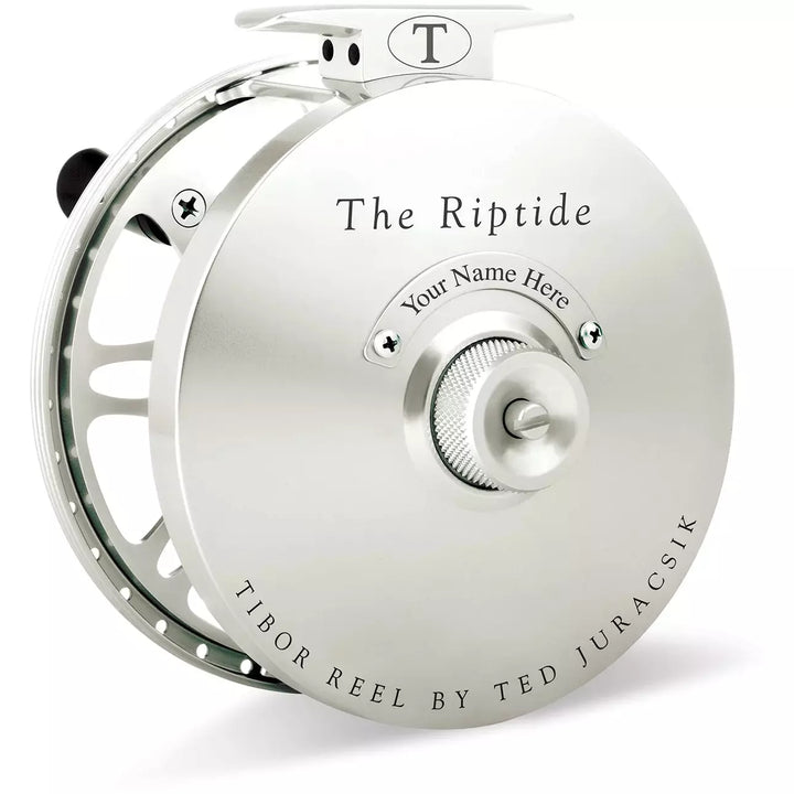 Silver metallic Tibor Riptide fly reel with smooth matte finish and precision engineering